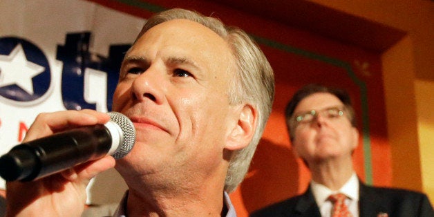 Texas Republican gubernatorial candidate Greg Abbott speaks as Lt. Gov. candidate Dan Patrick, right, looks over his shoulder at a campaign event, Monday, Nov. 3, 2014, in Houston. (AP Photo/Pat Sullivan)