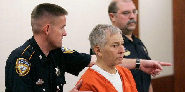 Robert Durst is escorted into the courtroom for a parole revocation hearing held by the Texas Board of Pardons and Paroles, Friday, Jan. 13, 2006, in Houston. The parole officer for the New York real estate heir acquitted of murdering his Galveston neighbor recommended the eccentric millionaire be housed in a prison facility for parole violators after he made unscheduled trips to Galveston and Houston that were against the terms of his release. (AP Photo/David J. Phillip)