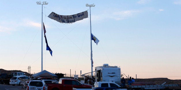 MESQUITE, NV - APRIL 10: Protesters hang signs and set up camp along US. highway 170 protesting the closure of thousands of acres of Bureau of Land Management land that has been temporarily closed to round-up illegal cattle that are grazing south of Mesquite Nevada on April 10, 2014 in Mesquite, Nevada. BLM officials are rounding up ranchers Cliven Bundy's cattle, who has been locked in a dispute with the BLM for a couple of decades over grazing rights. (Photo by George Frey/Getty Images