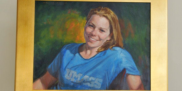 This photo released Thursday, Nov. 21, 2013, by the University of Massachusetts-Boston shows a painting of Boston Marathon bo