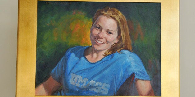 This photo released Thursday, Nov. 21, 2013, by the University of Massachusetts-Boston shows a painting of Boston Marathon bombing victim and former University of Massachusetts-Boston student Krystle Campbell, which was unveiled on campus the previous week. Campbell, 29, a former student at the school, was one of three people killed in the April 15 bombings. (AP Photo/University of Massachusetts-Boston, Harry Brett)