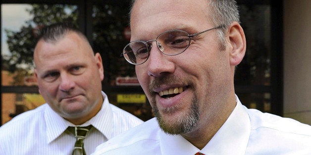 FILE - In this Aug. 19, 2009, file photo, a smiling Kenneth Ireland leaves Superior Court in New Haven, Conn., after all charges were dropped against him in connection with the rape and murder of Barbara Pelkey. New DNA evidence proved he did not commit the crimes. Ireland filed a wrongful imprisonment claim against the state seeking up to $8 million, and a hearing begins Tuesday, July 29, 2014, to determine how much he should be compensated. (AP Photo/Bob Child, File)