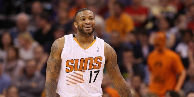 PHOENIX, AZ - APRIL 06: P.J. Tucker #17 of the Phoenix Suns during the NBA game against the Oklahoma City Thunder at US Airways Center on April 6, 2014 in Phoenix, Arizona. The Suns defeated the Thunder 122-115. NOTE TO USER: User expressly acknowledges and agrees that, by downloading and or using this photograph, User is consenting to the terms and conditions of the Getty Images License Agreement. (Photo by Christian Petersen/Getty Images) 