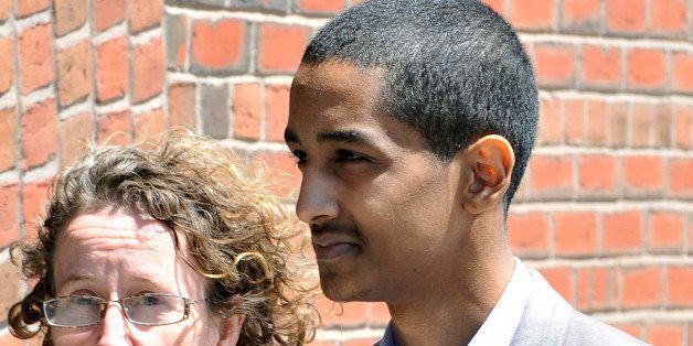 Defense attorneys Susan Church, left, arrives with client Robel Phillipos for his sentencing in federal court Friday, June 5, 2015, in Boston. Phillipos was convicted of lying to the FBI about being in the dorm room of convicted Boston Marathon bomber Dzhokhar Tsarnaev in April in2103 when items were removed by two other classmates. (AP Photo/Josh Reynolds)