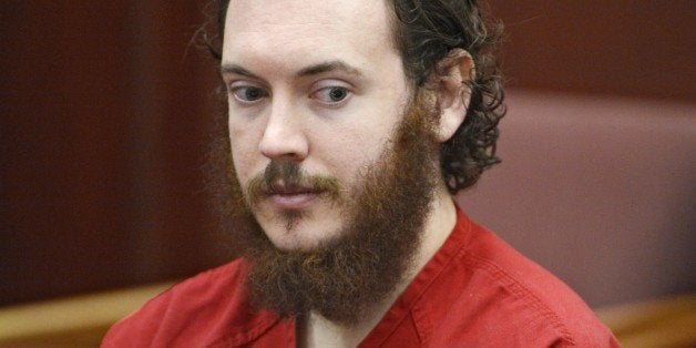 FILE - In this June 4, 2013, file photo, Aurora, Colo., theater shooting defendant James Holmes appears in court in Centennial, Colo. Taxpayer costs for the Colorado theater shooting case have risen to at least $2.2 million before the trial has even started. That figure doesn't include legal costs for the defendant. The Holmes trial is expected to start April 27. (AP Photo/The Denver Post, Andy Cross, Pool, File)