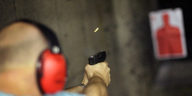 DALLAS - JUNE 26: John Sanders of Irving, TX, shoots his glock pistol June 26th at the DFW Gun Range and Training Center in Dallas, Texas. The U.S. Supreme Court ruled Thursday that a ban on handguns in our nation's capitol was a violation of the Second Amendment right to bear arms. (Photo by Rick Gershon/Getty Images)