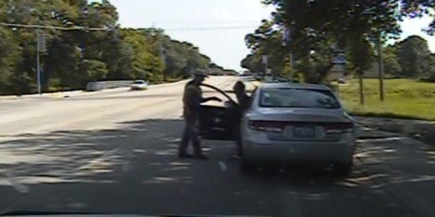 In this July 10, 2015, frame from dashcam video provided by the Texas Department of Public Safety, a heated confrontation between trooper Brian Encinia leads to the arrest of Sandra Bland after a minor traffic infraction in which the state trooper tried to drag Bland from her car, drew his stun gun and threatened that he would "light you up" in Waller County, Texas. Bland was taken to the Waller County Jail that day and was found dead in her cell on July 13. (Texas Department of Public Safety via AP)