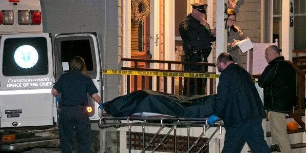 ARLINGTON, MA - NOVEMBER 18: A second body was removed from the home. The scene of a a triple murder and suicide on Newland Road in Arlington, Mass. on Monday, Nov. 18, 2013. The family was identified as Scott Jones, 43, Mei Kum Jones, 43, and their sons Colt and Cameron. (Photo by Yoon S. Byun/The Boston Globe via Getty Images)