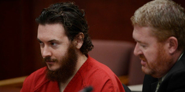 CENTENNIAL, CO - JUNE 04: James Holmes, left, and his defense attorney, Daniel King, in court Tuesday morning June 04, 2013 for an advisement hearing at the Arapahoe County Justice Center. Holmes is accused of killing 12 people and injuring 70 others in a shooting rampage at an Aurora theater, July 20th, 2012. The court accepted James Holmes plea of not guilty by reason of insanity and has ordered a sanity evaluation at the Colorado Mental Health Institute of Pueblo. (Photo By Andy Cross/The Denver Post via Getty Images)