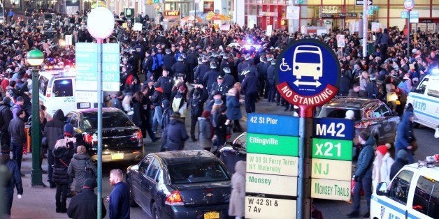 December 4 2015 New York NY Protestors take to the streets in NYC from Times Square to China Town marching, laying on the ground and chanting. Matthew Nelson/MediaPunch/IPX