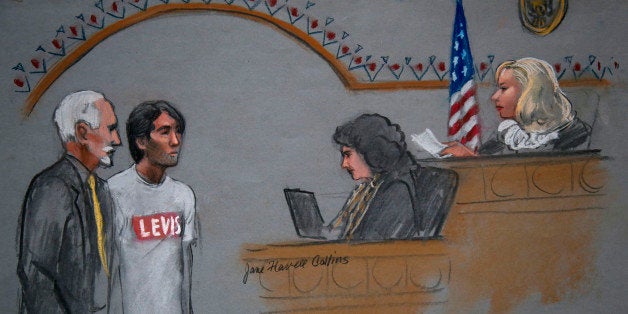 In this courtroom sketch, Khairullozhon Matanov, second from left, with attorney Paul Glickman, left, appears in federal cour