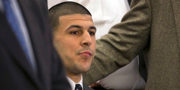 Former New England Patriots football player Aaron Hernandez listens as the guilty verdict is read during his murder trial at the Bristol County Superior Court in Fall River, Mass., Wednesday, April 15, 2015. Hernandez was found guilty of first-degree murder in the shooting death of Odin Lloyd in June 2013. He faces a mandatory sentence of life in prison without parole. (Dominick Reuter/Pool Photo via AP)