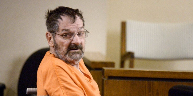 OLATHE, KS - APRIL 24: Frazier Glenn Cross, also known as Frazier Glenn Miller, sits with his defense team after being wheeled into a Johnson County courtroom for a scheduling session April 24, 2014, in Olathe, Kanas. Miller is charged in killing two people at the Jewish Community Center of Greater Kansas City and one person at Village Shalom Retirement Community, in Overland Park, Kanas. (Photo by John Sleezer-Pool/Getty Images)