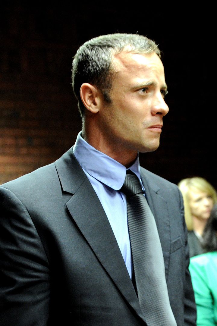 South African Olympic sprinter Oscar Pistorius appears on February 19, 2013 at the Magistrate Court in Pretoria. Pistorius battled to secure bail as he appeared on charges of murdering his model girlfriend Reeva Steenkamp on February 14, Valentine's Day. South African prosecutors will argue that Pistorius is guilty of premeditated murder in Steenkamp's death, a charge which could carry a life sentence. AFP PHOTO / STEPHANE DE SAKUTIN (Photo credit should read STEPHANE DE SAKUTIN/AFP/Getty Images)