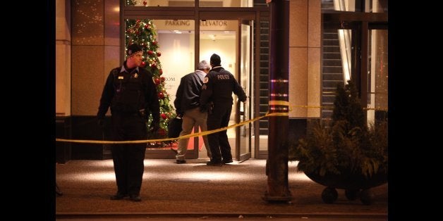 Chicago police secure the Wabash and Grand Avenues entrance to the Nordstrom store on Michigan Avenue in downtown Chicago, where two people were shot Friday, Nov. 28, 2014. (Mark Hume/Chicago Tribune/TNS via Getty Images)