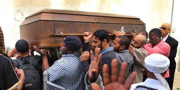 BOSTON - JUNE 5: A funeral service was held for accused terrorist who was shot in Roslindale earlier this week, Usaama Rahim, at a mosque on Shawmut Avenue. His casket is carried to the hearse from an outside service. (Photo by John Tlumacki/The Boston Globe via Getty Images)