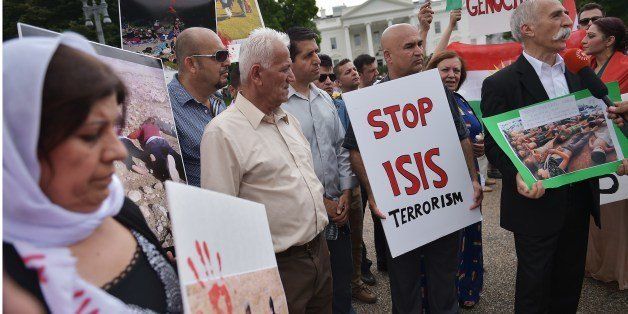 Demonstrators call for the end to Islamic State of Iraq and Syria (ISIS) terrorism during a Kurdish demonstration in front of the White House on August 9, 2014 in Washington, DC. US President Barack Obama warned Saturday that the US offensive in Iraq was a 'long-term project' to rout out militants and deliver aid to beleaguered civilians. AFP PHOTO/Mandel NGAN (Photo credit should read MANDEL NGAN/AFP/Getty Images)