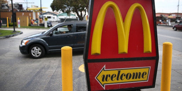 SAN FRANCISCO, CA - APRIL 22: A car enters a McDonald's restaurant on April 22, 2015 in San Francisco, California. McDonald's reported a decline in first quarter revenues with a profit of $811.5 million, or 84 cents a share compared to $1.2 billion, or $1.21 a share, one year ago. (Photo by Justin Sullivan/Getty Images)