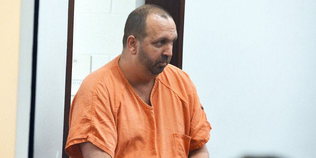 Craig Stephen Hicks, 46, enters the courtroom for his first appearance Wednesday, Feb. 11, 2015 at the Durham County Detention Center in Durham, N.C. He is accused of shooting his Finley Forest neighbors, Deah Shaddy Barakat, 23, and his wife Yusor Abu-Salha, 21, and Abu-Salhav's sister, Razan Abu-Salha, 19, of Raleigh. Hicks is being held in the Durham County jail with no bond. (Chuck Liddy/News & Observer/TNS via Getty Images)