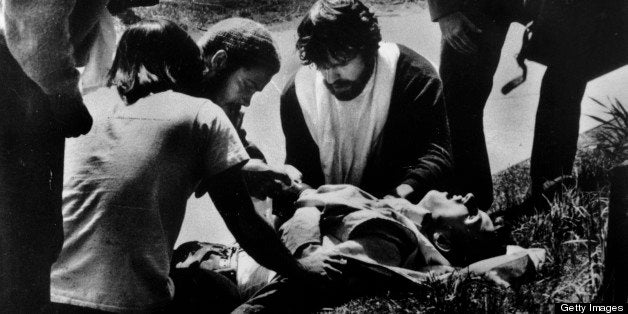 UNITED STATES - JANUARY 01: Kent State students gathering around a wounded student who was shot by the National Guard during