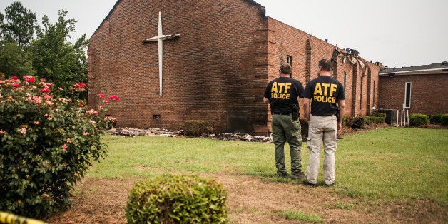 GREELEYVILLE, SC - JULY 1: Investigators with the Bureau of Alcohol, Tobacco and Firearms examine the burned ruins of the Mt. Zion AME Church July 1, 2015 in Greeleyville, South Carolina. Federal and state agencies are investigating a recent string of church fires in the South that have occured since the church massacre in nearby Charleston, South Carolina. Mt. Zion AME was burned twenty years ago by members of the Ku Klux Klan. (Photo by Sean Rayford/Getty Images)