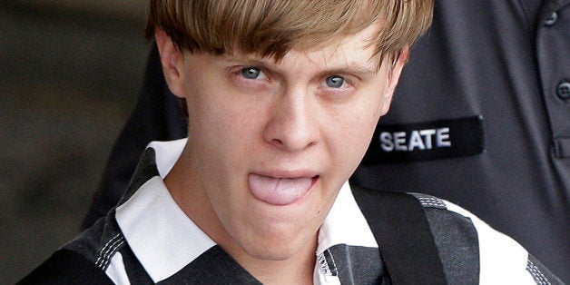 Charleston, S.C., shooting suspect Dylann Storm Roof is escorted from the Cleveland County Courthouse in Shelby, N.C., Thursday, June 18, 2015. Roof is a suspect in the shooting of several people Wednesday night at the historic The Emanuel African Methodist Episcopal Church in Charleston. (AP Photo/Chuck Burton)