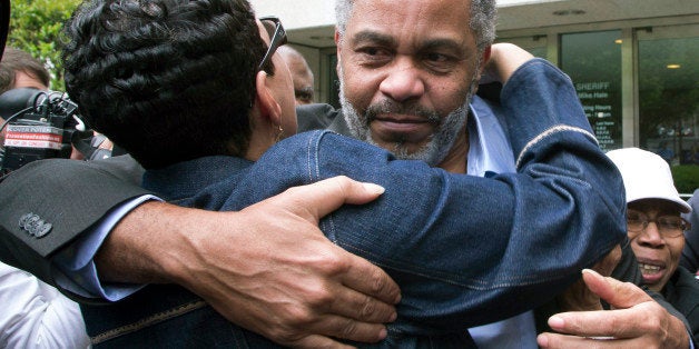 FILE - In this April 3, 2015 file photo, Pat Turner, left, hugs Anthony Ray Hinton as he leaves the Jefferson County jail in