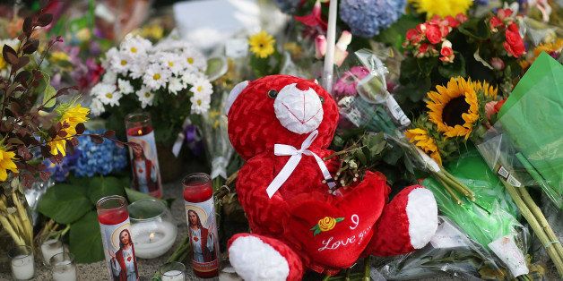 CHARLESTON, SC - JUNE 19: A teddy bear is seen in the memorial setup in front of Emanuel African Methodist Episcopal Church after a mass shooting at the church that killed nine people of June 19, 2015. A 21-year-old white gunman is suspected of killing nine people during a prayer meeting in the church, which is one of the nation's oldest black churches in Charleston. (Photo by Joe Raedle/Getty Images)