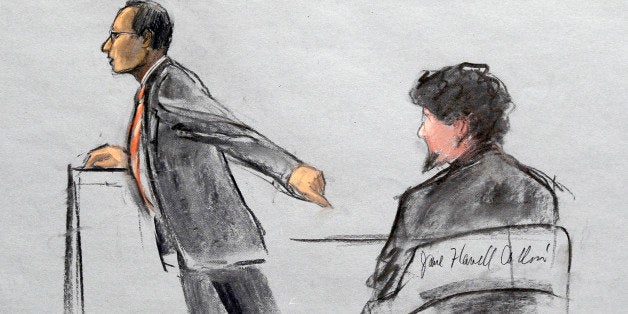In this courtroom sketch, Assistant U.S. Attorney Aloke Chakravarty is depicted pointing to defendant Dzhokhar Tsarnaev, righ
