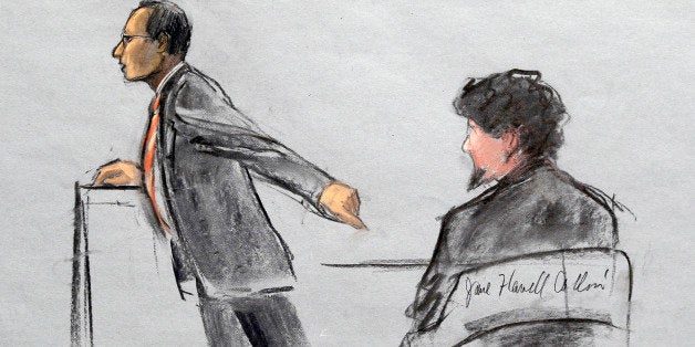 In this courtroom sketch, Assistant U.S. Attorney Aloke Chakravarty is depicted pointing to defendant Dzhokhar Tsarnaev, right, during closing arguments in Tsarnaev's federal death penalty trial Monday, April 6, 2015, in Boston. Tsarnaev is charged with conspiring with his brother to place two bombs near the Boston Marathon finish line in April 2013, killing three and injuring 260 people. (Jane Flavell Collins via AP)