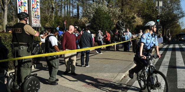 WASHINGTON - APRIL 21:Patrons leave the National Zoo after it was closed due to a shooting near the Connecticut Avenue entrance to the Smithsonian National Zoo on Monday, April 21, 2013. Police say a group of people were walking southbound on Connecticut Avenue across from the zoo when a person produced a handgun and fired several rounds injuring two.(Photo by Toni L. Sandys/The Washington Post via Getty Images)