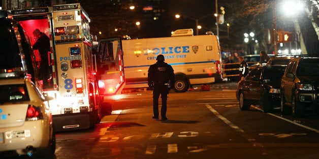 NEW YORK, NY - DECEMBER 20: The scene at a shooting where two New York City police officers were killed execution style Saturday afternoon as they sat in their marked police car on a Brooklyn street corner> on December 20, 2014 in New York City. The suspect, who killed his girlfriend in Baltimore earlier in the day, was apparently motivated by the deaths of Eric Garner and Michael Brown. (Photo by Spencer Platt/Getty Images)