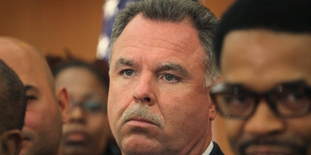 CHICAGO, IL - JULY 09: Chicago Police Superintendent Garry McCarthy listens as Mayor Rahm Emanuel (not pictured) speaks at a press conference in the Englewood neighborhood on July 9, 2012 in Chicago, Illinois. The mayor announced an initiative to identify, secure, or demolish vacant buildings in the city to prevent gangs from using them as gathering places. The city has seen a sharp increase in gang-related violence in 2012. There have been 259 homicides in Chicago through June, a 37.8 percent increase from last year. There have been 16 homicides recorded so far in July. (Photo by Scott Olson/Getty Images)