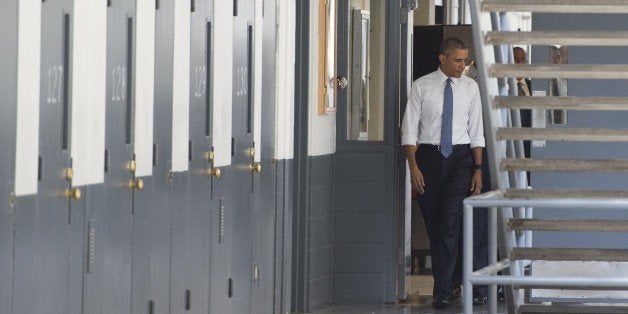 US President Barack Obama tours a cell block at the El Reno Federal Correctional Institution in El Reno, Oklahoma, July 16, 2015. Obama is the first sitting US President to visit a federal prison, in a push to reform one of the most expensive and crowded prison systems in the world. AFP PHOTO/ SAUL LOEB (Photo credit should read SAUL LOEB/AFP/Getty Images)