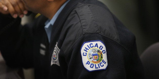 CHICAGO, IL - JANUARY 31: Chicago police officer David Norman waits for the arrival of Mayor Rahm Emanuel at the 2nd Distric