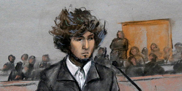 In this courtroom sketch, Boston Marathon bombing suspect Dzhokhar Tsarnaev is depicted sitting in federal court in Boston Thursday, Dec. 18, 2014, for a final hearing before his trial begins in January. Tsarnaev is charged with the April 2013 attack that killed three people and injured more than 260. He could face the death penalty if convicted. (AP Photo/Jane Flavell Collins)