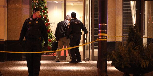 Chicago police secure the Wabash and Grand Avenues entrance to the Nordstrom store on Michigan Avenue in downtown Chicago, where two people were shot Friday, Nov. 28, 2014. (Mark Hume/Chicago Tribune/TNS via Getty Images)