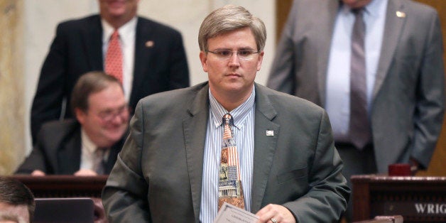 Rep. Justin T. Harris, R-West Fork, walks in the House chamber at the Arkansas state Capitol in Little Rock, Ark., Thursday, Feb. 12, 2015. The Senate passed the bill Thursday. (AP Photo/Danny Johnston)