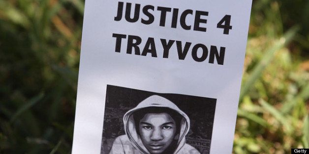 SANFORD, FL - JULY 13: A sign showing support for Trayvon Martin is stuck in the lawn in front of the Seminole County Criminal Justice Center where a jury is deliberating in the trial of George Zimmerman on July 13, 2013 in Sanford, Florida. Zimmerman, a neighborhood watch volunteer, is on trial for the February 2012 shooting death of 17-year-old Trayvon Martin. (Photo by Scott Olson/Getty Images)