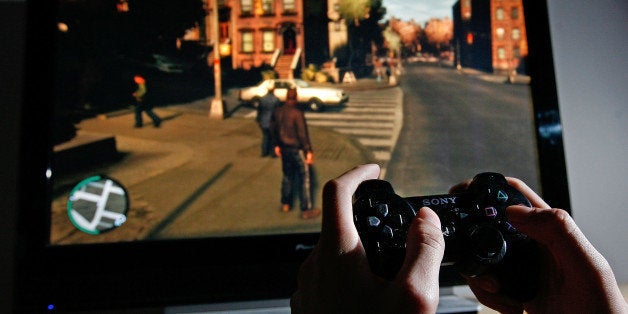 LONDON - APRIL 29: A young man plays Grand Theft Auto IV on the game's day of release on April 29, 2008 in London, England. The game designed for the Playstation 3 was in high demand and sold out in stores across London during its first day of sale. (Photo by Cate Gillon/Getty Images)