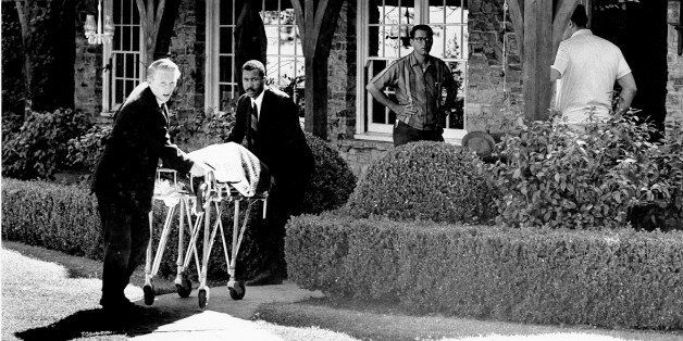 The body of actress Sharon Tate is taken from her rented house on Cielo Drive in Beverly Hills, Calif., on Aug. 9, 1969. Tate, who was eight months pregnant, and four other persons were found murdered by American cult-leader Charles Manson and his followers. Tate, the wife of director Roman Polanski, was born in 1943. (AP Photo)