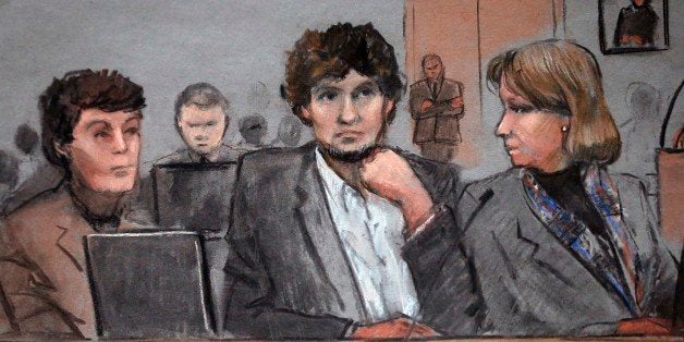 In this courtroom sketch, Dzhokhar Tsarnaev, center, is depicted between defense attorneys Miriam Conrad, left, and Judy Clarke, right, during his federal death penalty trial, Thursday, March 5, 2015, in Boston. Tsarnaev is charged with conspiring with his brother to place two bombs near the Boston Marathon finish line in April 2013, killing three and injuring 260 people. (AP Photo/Jane Flavell Collins)