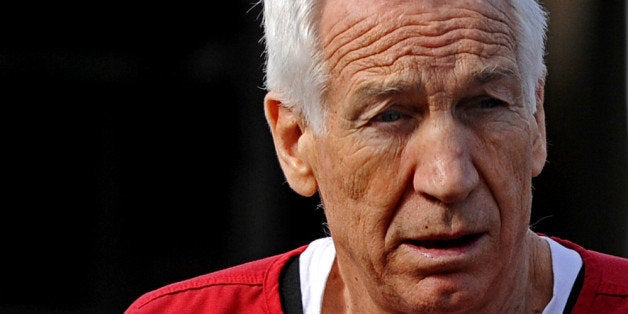 BELLEFONTE, PA - OCTOBER 09: Former Penn State assistant football coach Jerry Sandusky leaves the Centre County Courthouse after being sentenced in his child sex abuse case on October 9, 2012 in Bellefonte, Pennsylvania. The 68-year-old Sandusky was sentenced to at least 30 years and not more that 60 years in prison for his conviction in June on 45 counts of child sexual abuse, including while he was the defensive coordinator for the Penn State college football team. (Photo by Patrick Smith/Getty Images)