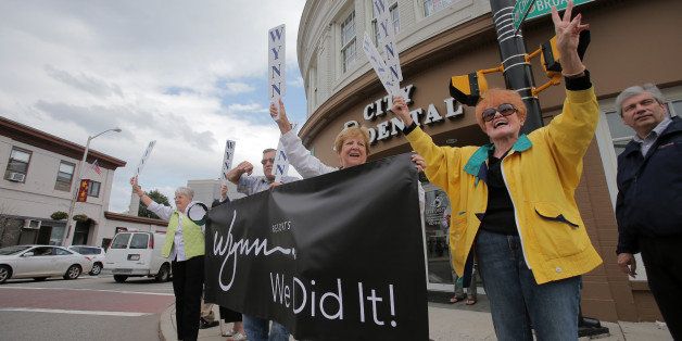 EVERETT, MA - SEPTEMBER 16: Everett residents celebrate outside Wynn's Everett headquarters on the corner of Chelsea Street and Broadway in Everett after the Massachusetts Gaming Commission voted to award the gaming license to Wynn, which plans to build a casino in Everett. (Photo by Lane Turner/The Boston Globe via Getty Images)