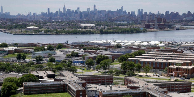 FILE- This June 20, 2014 file photo shows the Rikers Island jail with the New York skyline in the background. Over the past f