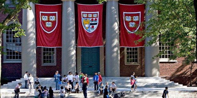 UNITED STATES - SEPTEMBER 03: Harvard banners hang outside Memorial Church on the Harvard University campus in Cambridge, Massachusetts, U.S., on Friday, Sept. 4, 2009. Community activists in Allston, a section of Boston across the Charles River from Harvard's main campus in Cambridge, say university delays have left a (Photo by Michael Fein/Bloomberg via Getty Images)