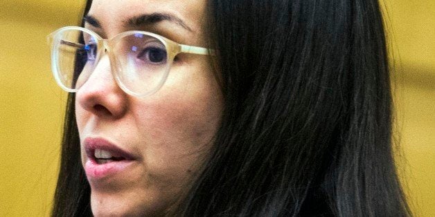 Jodi Arias looks at her attorney in Maricopa County Superior Court in Phoenix, Friday, Nov. 21, 2014, during the sentencing p