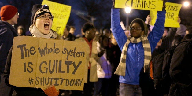 Protesters block streets after the announcement of the grand jury decision, Monday, Nov. 24, 2014, in St. Louis, Mo. A grand jury has decided not to indict Ferguson police officer Darren Wilson in the shooting death of 18-year-old Michael Brown. (AP Photo/Jeff Roberson)