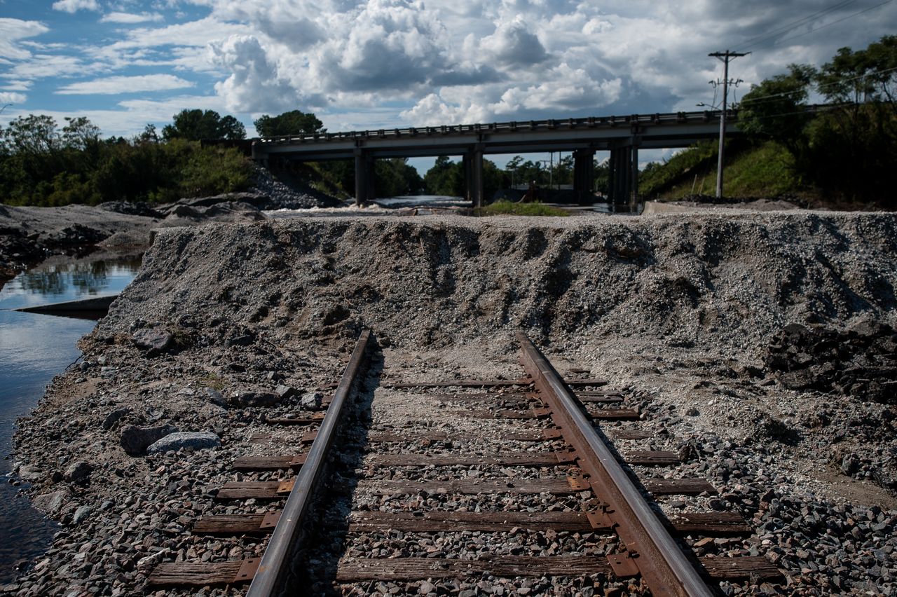A temporary levee of dirt, gravel and sandbags was built over the railroad track in Lumberton over the weekend in an attempt to hold back Lumber River floodwaters.