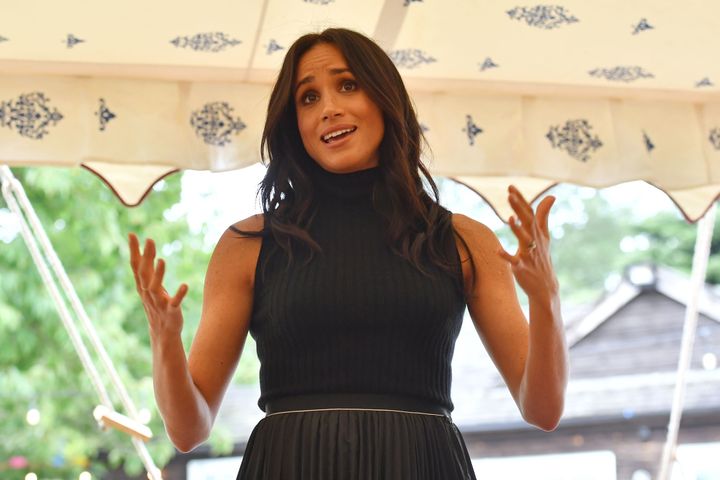 Meghan speaking to the guests at the cookbook event. 